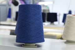 blue thread on a modern knitting machine